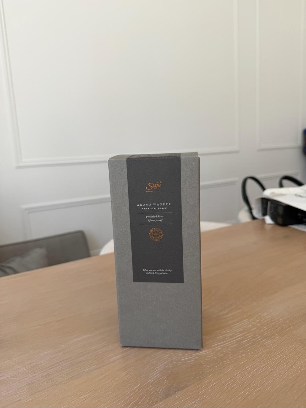 Saje Aroma Wander Diffuser - Gray with Black Label and Gold Logo